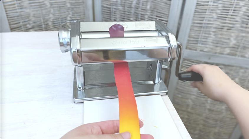stretching long gradient sheet through pasta machine