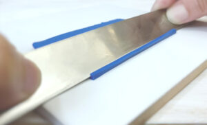 slicing blue clay at an angle